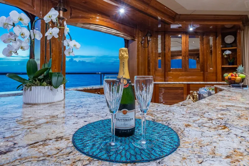 Amore Yacht Photos Pics Luxurious 2005 Christensen motor yacht interior with champagne, orchids, and ocean view.