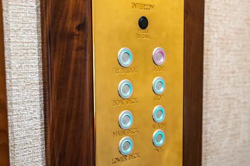 Amore Yacht Photos Pics Intercom panel on 2005 Christensen Motor Yacht with labeled buttons for various decks.