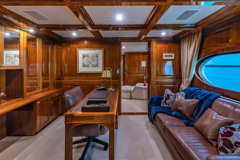 Amore Yacht Photos Pics Luxurious 2005 Christensen motor yacht interior with elegant wood paneling and plush seating.
