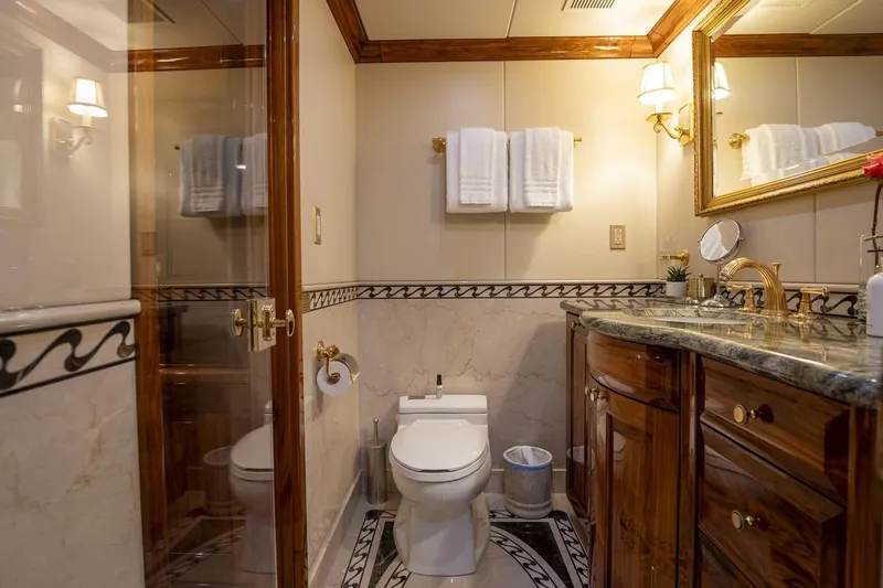 Amore Yacht Photos Pics Luxurious bathroom on 2005 Christensen motor yacht with elegant wood and marble finishes.