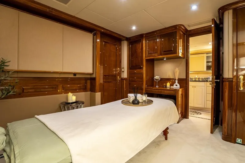 Amore Yacht Photos Pics Luxurious spa room on 2005 Christensen Motor Yacht with elegant wood finishes and ambient lighting.
