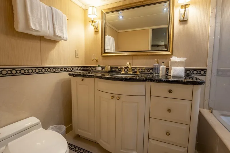 Amore Yacht Photos Pics Luxurious bathroom on 2005 Christensen Motor Yacht with elegant fixtures and marble countertop.