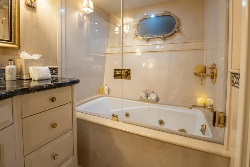 Amore Yacht Photos Pics Luxurious bathroom on 2005 Christensen Motor Yacht with elegant fixtures and jacuzzi tub.