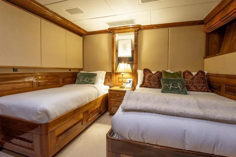 Amore Yacht Photos Pics Luxurious twin bedroom on 2005 Christensen Motor Yacht with elegant wood finishes.