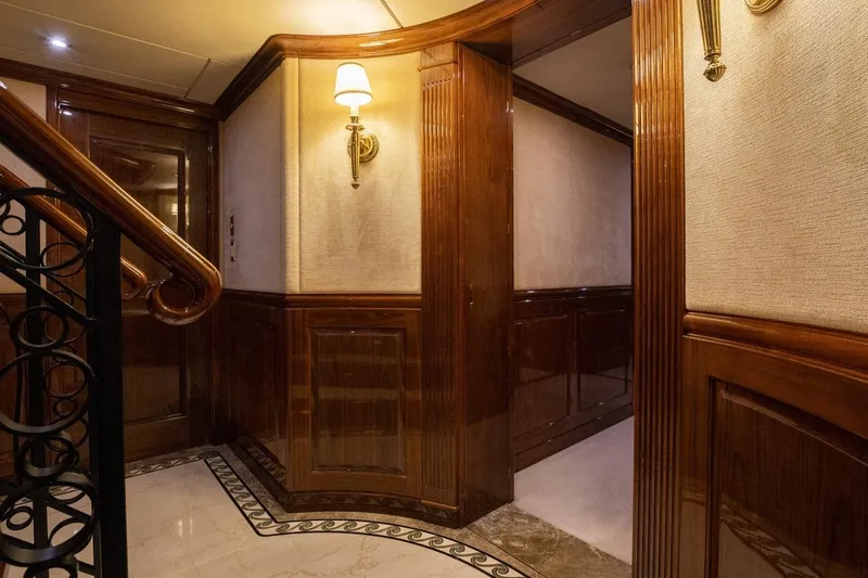 Amore Yacht Photos Pics Luxurious interior of 2005 Christensen motor yacht with elegant wood paneling and soft lighting.