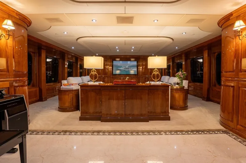 Amore Yacht Photos Pics Luxurious interior of 2005 Christensen motor yacht with elegant wood paneling and ambient lighting.
