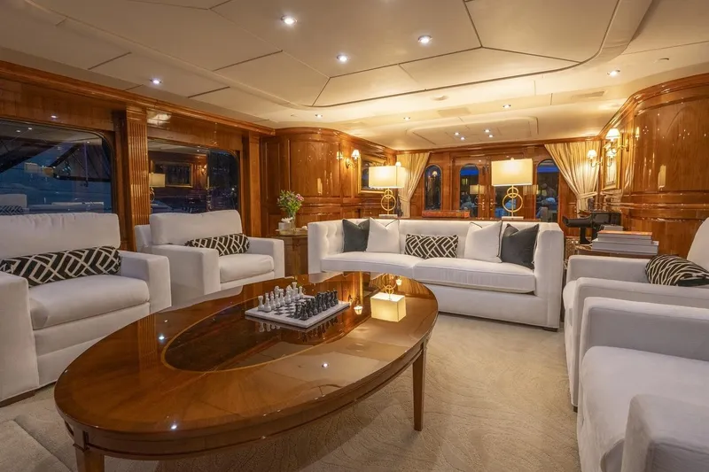 Amore Yacht Photos Pics Luxurious 2005 Christensen motor yacht interior with elegant seating and chess set.
