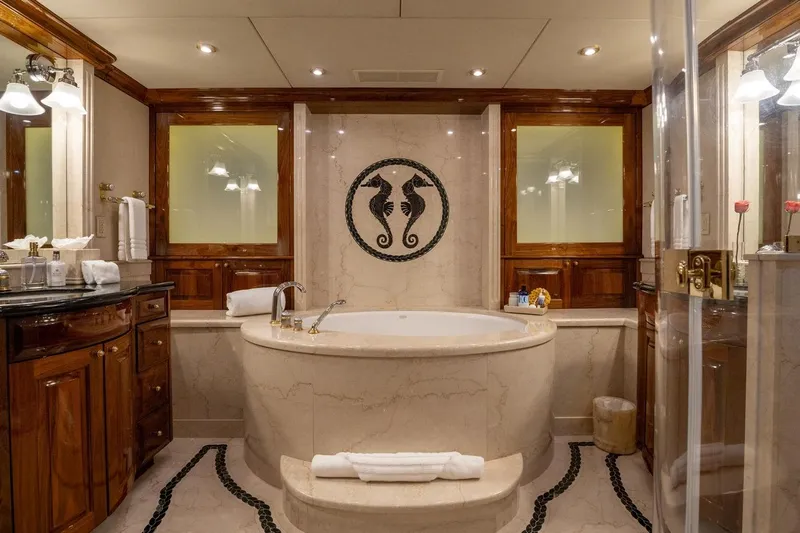 Amore Yacht Photos Pics Luxurious 2005 Christensen motor yacht bathroom with elegant marble tub and seahorse decor.