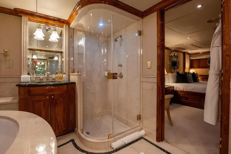 Amore Yacht Photos Pics Luxurious 2005 Christensen motor yacht bathroom with elegant wood accents and glass shower.