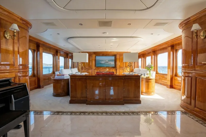 Amore Yacht Photos Pics Luxurious interior of a 2005 Christensen motor yacht with elegant wood paneling and ocean views.