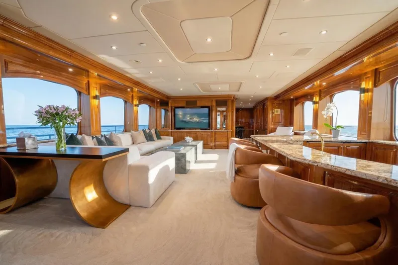 Amore Yacht Photos Pics Luxurious interior of a 2005 Christensen motor yacht with elegant wood finishes and ocean views.