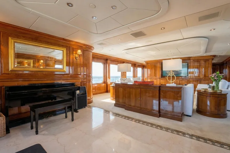 Amore Yacht Photos Pics Luxurious 2005 Christensen motor yacht interior with elegant wood paneling and grand piano.