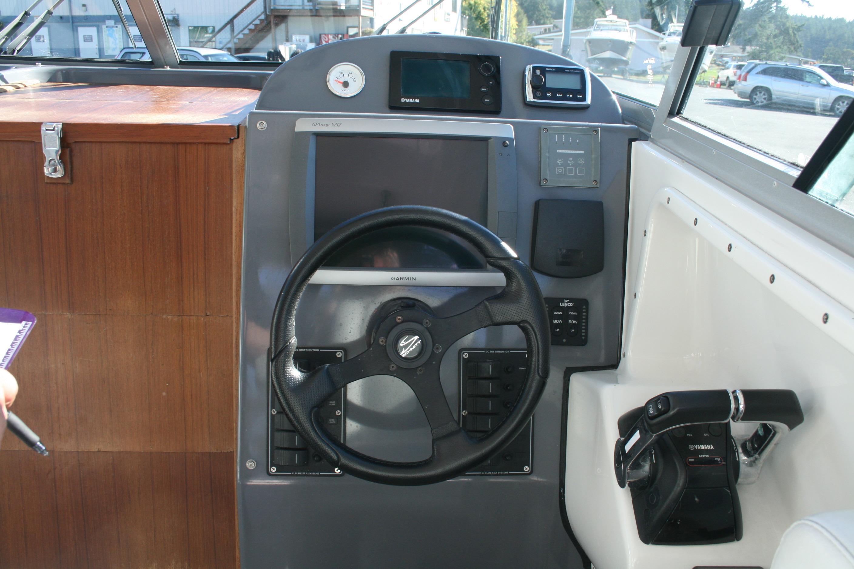2012 Protector Targa 30 boat dashboard with Garmin navigation and Yamaha controls.