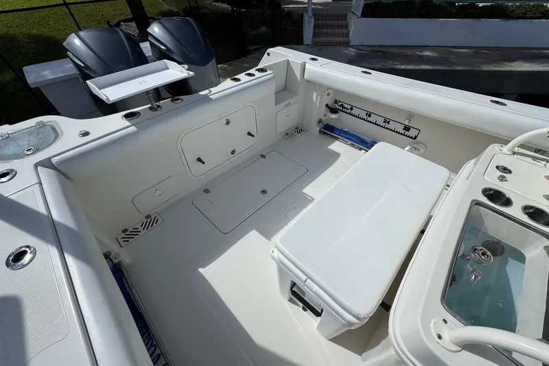  Yacht Photos Pics 2016 Sailfish 320 CC boat interior with dual engines and fishing amenities.