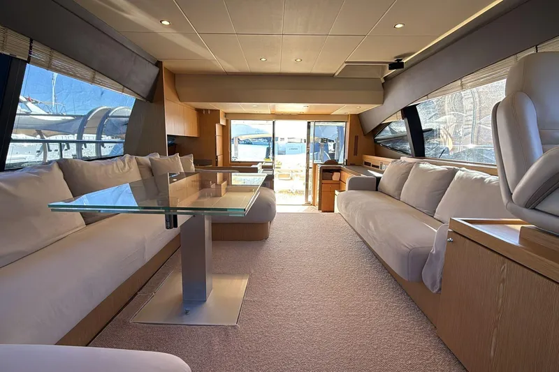  Yacht Photos Pics Luxurious interior of a 2013 Ferretti 620 yacht with modern furnishings and large windows.