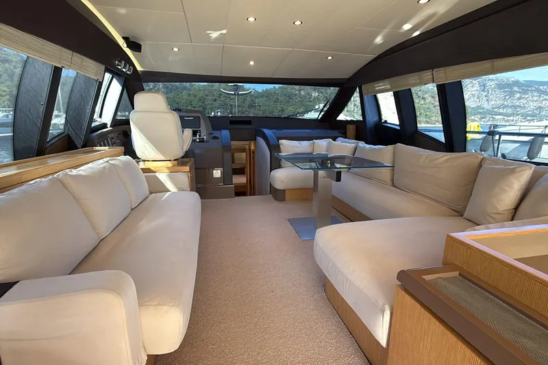  Yacht Photos Pics Luxurious interior of a 2013 Ferretti 620 yacht with plush seating and modern design.