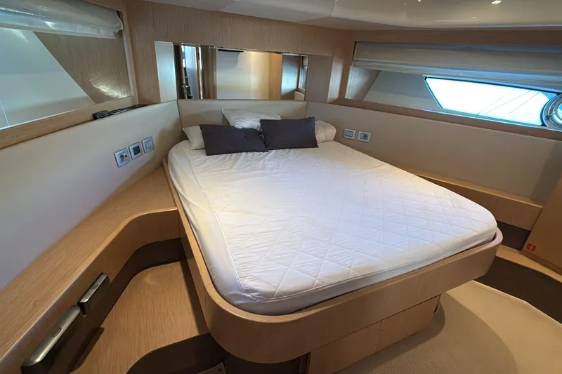 Yacht Photos Pics Luxurious bedroom interior of 2013 Ferretti 620 yacht with modern design and cozy bedding.