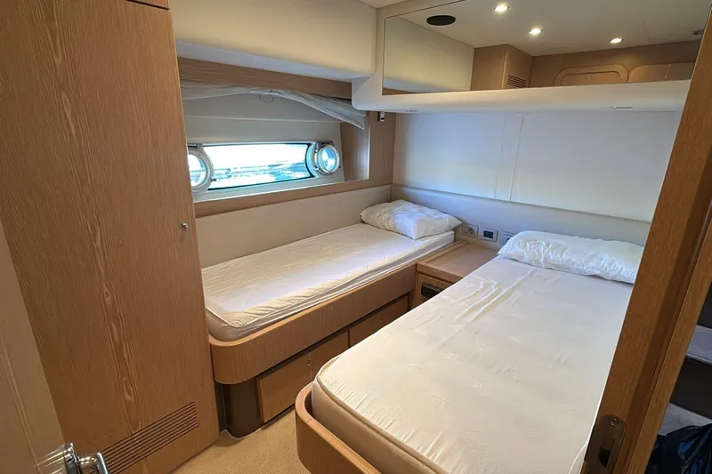 Yacht Photos Pics Interior cabin of 2013 Ferretti 620 yacht with twin beds and modern design.