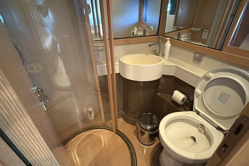  Yacht Photos Pics Luxurious bathroom in 2013 Ferretti 620 yacht with modern fixtures and shower.