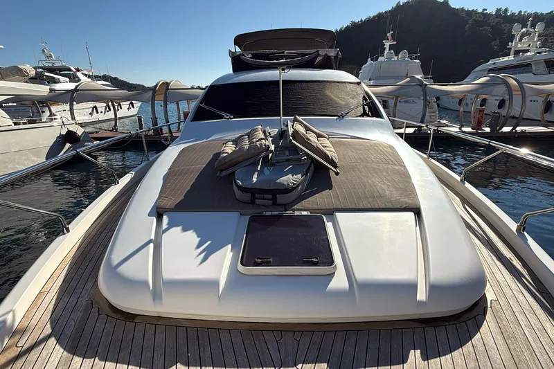  Yacht Photos Pics 2013 Ferretti 620 yacht docked, featuring sunbathing area and sleek design.