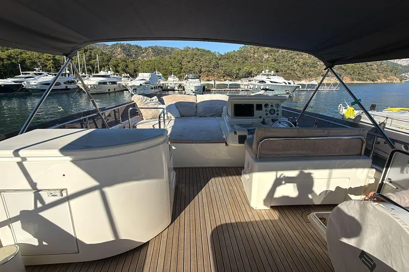  Yacht Photos Pics Luxurious 2013 Ferretti 620 yacht interior with helm, seating, and scenic marina view.