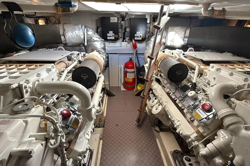  Yacht Photos Pics Engine room of a 2013 Ferretti 620 yacht, featuring dual engines and safety equipment.