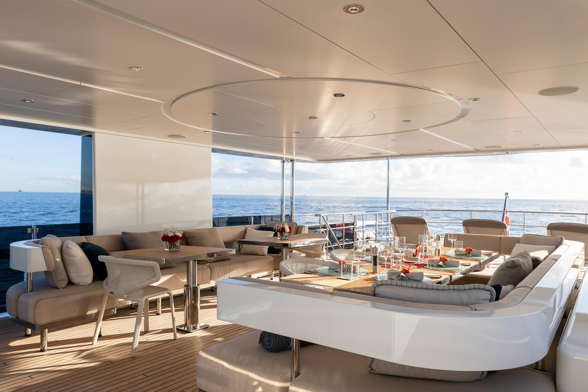 Luxurious 2016 Feadship Lagoon Cruiser yacht deck with elegant seating and ocean view.