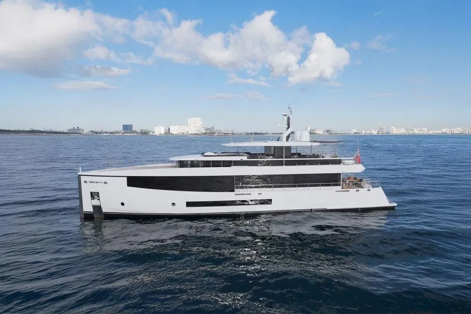 Luxurious 2016 Feadship Lagoon Cruiser yacht on open sea under blue sky.