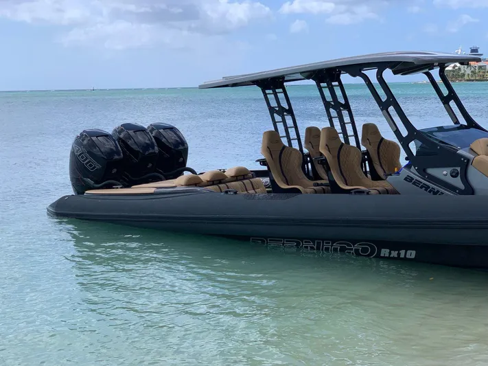  Yacht Photos Pics 2018 Bernico RX10 speedboat with triple engines on calm turquoise water.