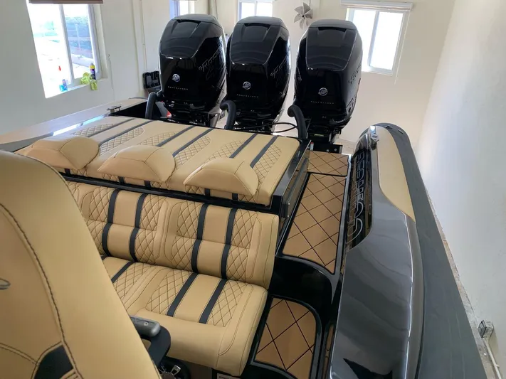  Yacht Photos Pics Luxurious 2018 Bernico RX10 boat interior with triple outboard engines and plush seating.