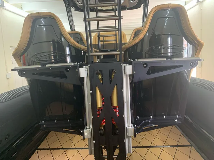  Yacht Photos Pics 2018 Bernico RX10 boat interior with sleek black seats and modern design elements.