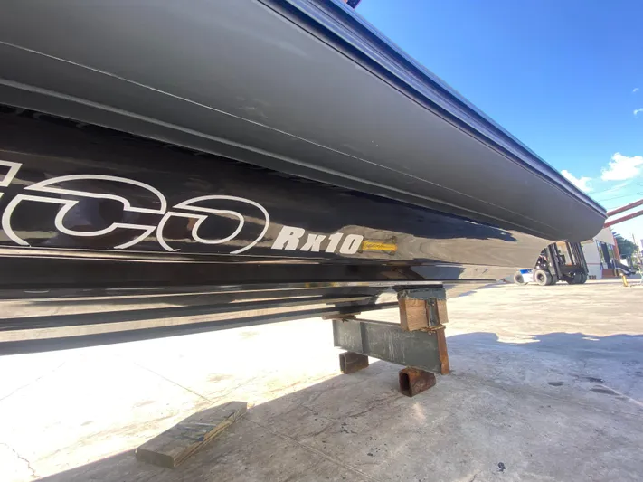  Yacht Photos Pics 2018 Bernico RX10 boat on dock, showcasing sleek black hull design.