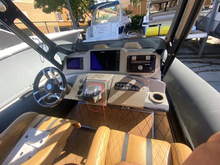  Yacht Photos Pics Interior of a 2018 Bernico RX10 boat with modern dashboard and controls.