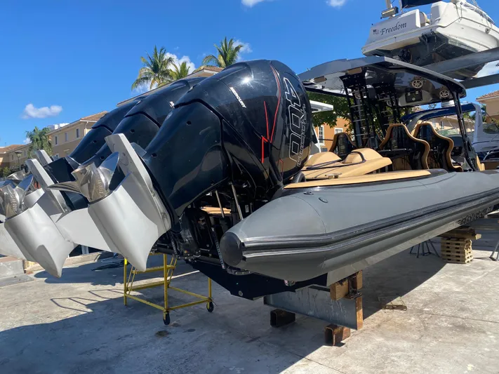  Yacht Photos Pics 2018 Bernico RX10 speedboat with dual engines, docked on a sunny day.