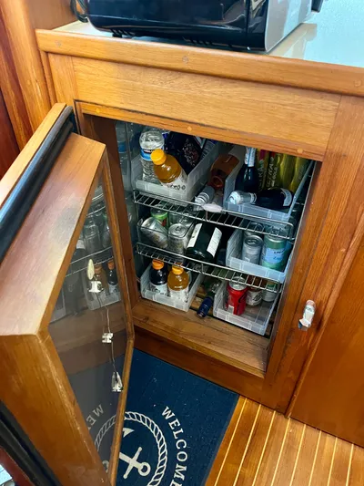  Yacht Photos Pics Mini fridge stocked with beverages inside a 1997 Grand Banks 49 Classic yacht.