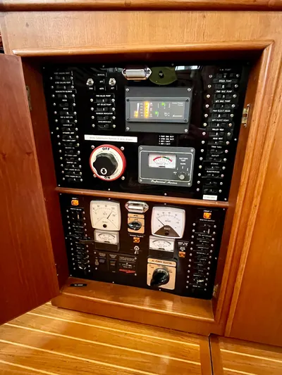  Yacht Photos Pics Electrical panel of a 1997 Grand Banks 49 Classic yacht, featuring various gauges and controls.