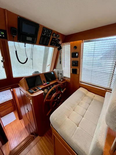  Yacht Photos Pics Interior of 1997 Grand Banks 49 Classic yacht with wooden helm and navigation equipment.