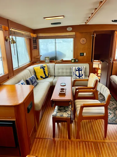  Yacht Photos Pics Interior of a 1997 Grand Banks 49 Classic yacht with elegant wood finish and nautical decor.