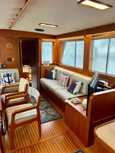  Yacht Photos Pics Interior of 1997 Grand Banks 49 Classic yacht with wooden decor and comfortable seating.