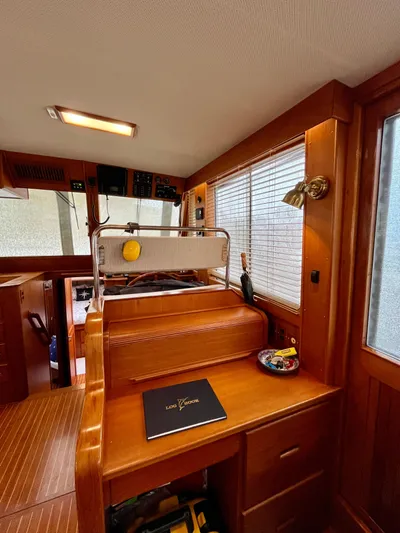  Yacht Photos Pics 1997 Grand Banks 49 Classic interior with wooden finish and navigation station.