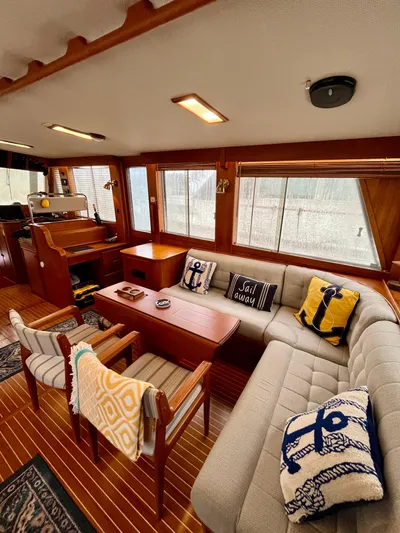 Yacht Photos Pics Interior of 1997 Grand Banks 49 Classic yacht with cozy seating and nautical decor.