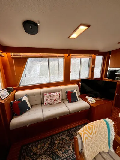  Yacht Photos Pics Interior of a 1997 Grand Banks 49 Classic yacht with cozy seating and decor.