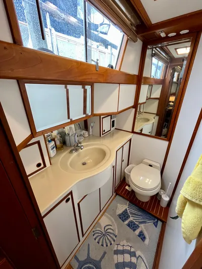  Yacht Photos Pics Bathroom interior of 1997 Grand Banks 49 Classic yacht, featuring sink and toilet.