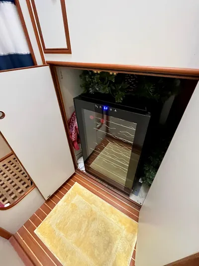  Yacht Photos Pics 1997 Grand Banks 49 Classic interior with a built-in wine cooler.