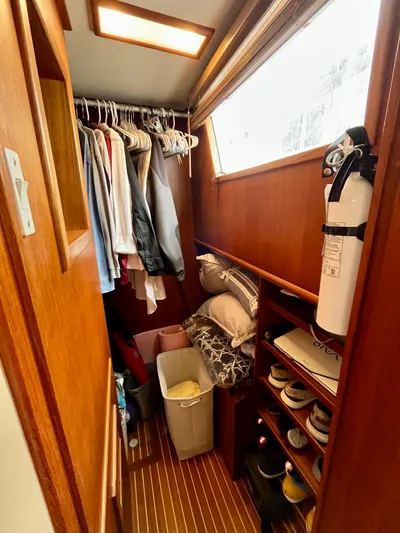  Yacht Photos Pics Cozy closet space in 1997 Grand Banks 49 Classic yacht with clothes and storage.