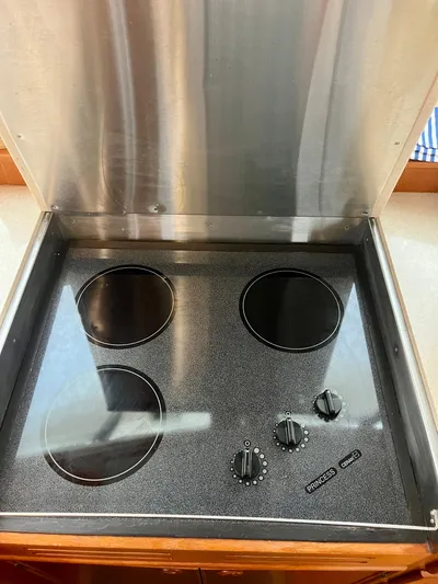  Yacht Photos Pics Stainless steel stovetop with four burners on a 1997 Grand Banks 49 Classic yacht.