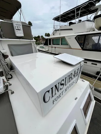  Yacht Photos Pics 1997 Grand Banks 49 Classic yacht docked, featuring "CINSUBAR" and "FORT MYERS" on the stern.