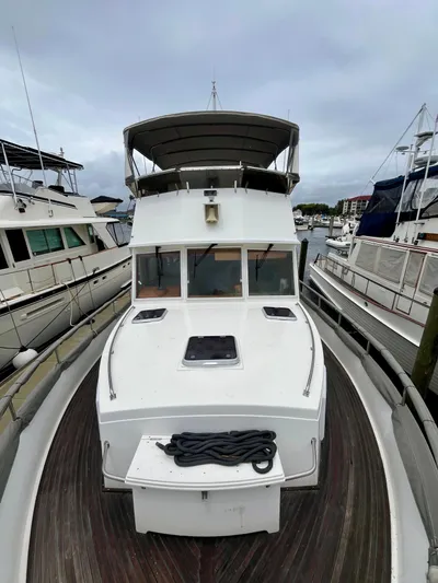  Yacht Photos Pics 1997 Grand Banks 49 Classic yacht docked at marina, front view.