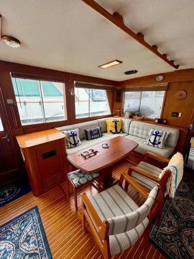  Yacht Photos Pics Interior of a 1997 Grand Banks 49 Classic yacht with wooden furnishings and nautical decor.