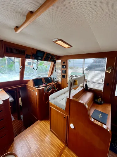  Yacht Photos Pics Interior of 1997 Grand Banks 49 Classic yacht with wooden finishes and navigation equipment.